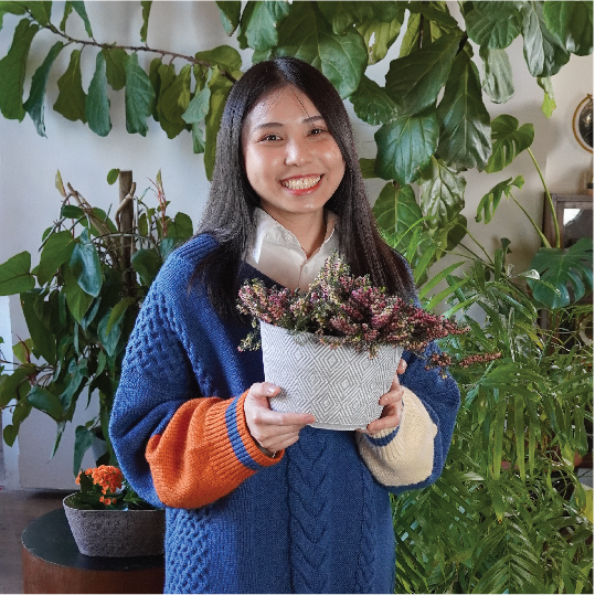 Image of cute girl holding pot